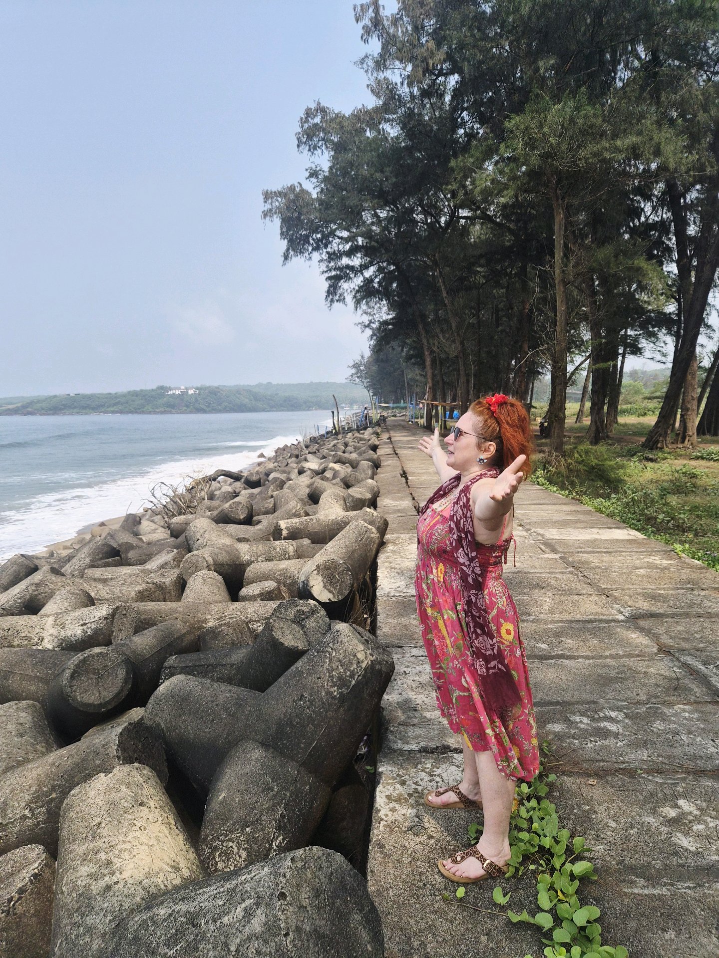 Enjoying a walk beside the waves and stone-paved coastal promenade