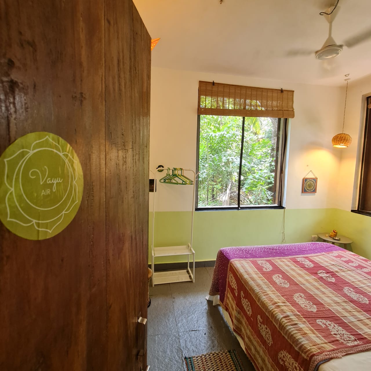 Vayu room at Laxmi Happy Home viewed from the doorway, with the Vayu Air sign